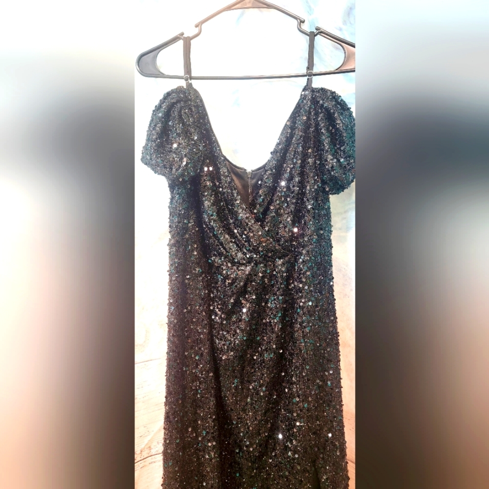 Long black sequin off the shoulder with straps, thigh split dress.